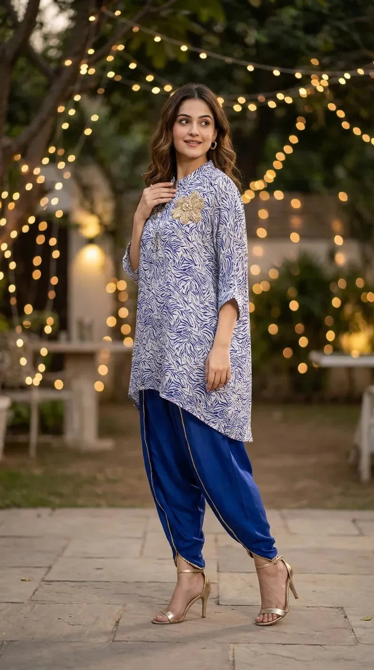 Woman wearing blue and white abstract print kaftan shirt motif and blue dhoti set from Karchobi