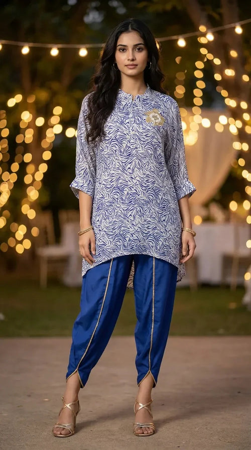 Woman in blue and white abstract print kaftan shirt and blue dhoti set, outdoor evening at Karchobi