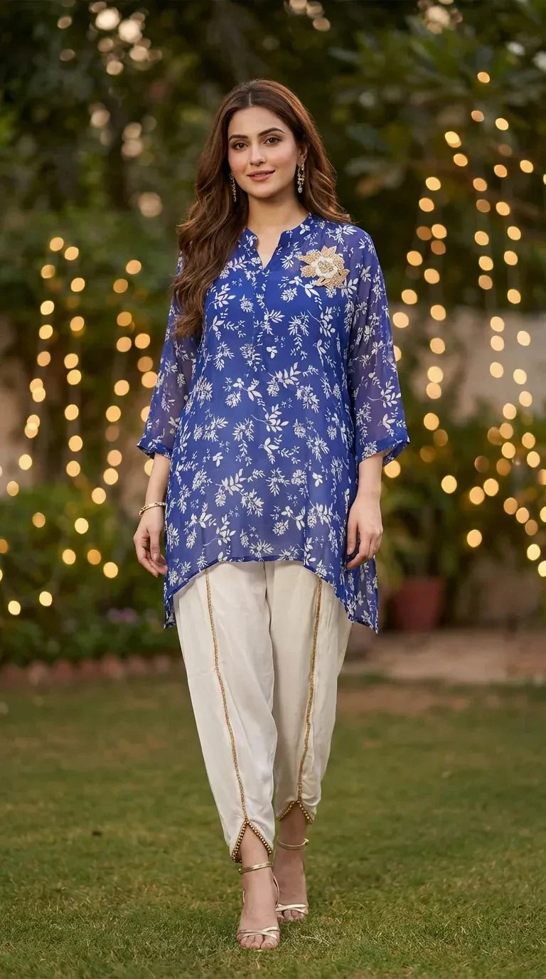 Woman wearing Karchobi blue floral print chinon kaftan shirt with white dhoti pants outdoors
