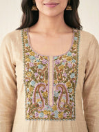 Beige chanderi cotton paisley embroidered suit set with kurta, pants, and dupatta featuring animal art embroidery by Karchobi.