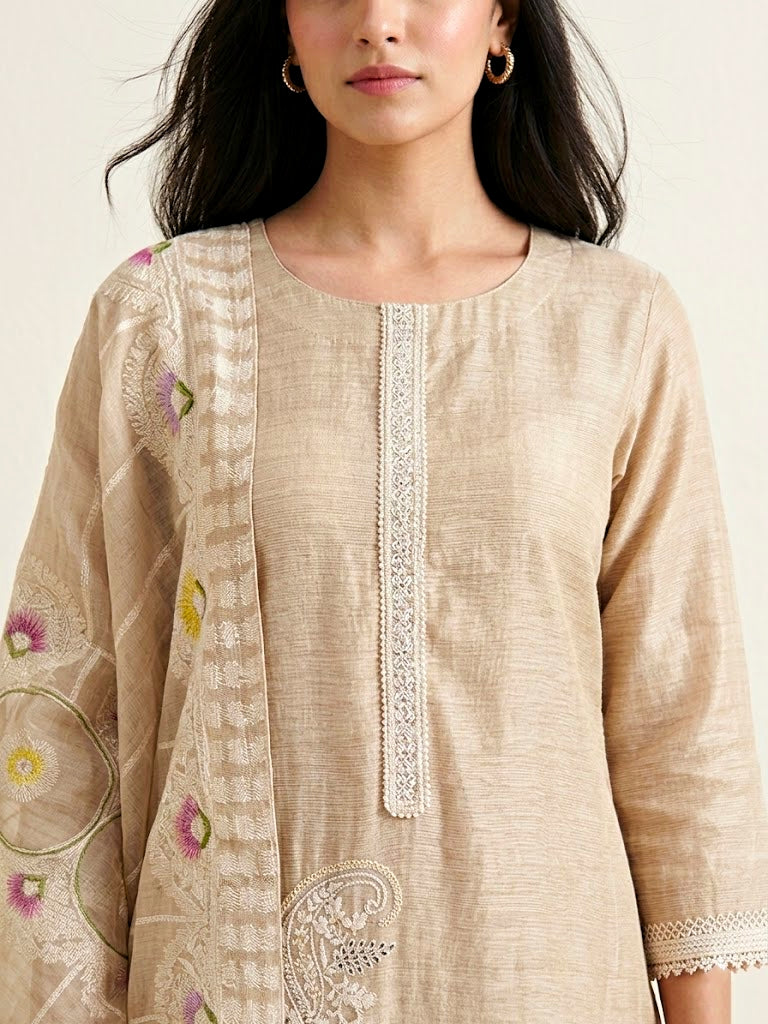 Beige chanderi cotton suit set with paisley embroidery, lace details, and matching dupatta, featuring intricate thread embroidery on kurta.