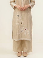 Beige chanderi cotton suit set with paisley embroidery, lace detail, and matching dupatta, featuring intricate thread embroidery on kurta