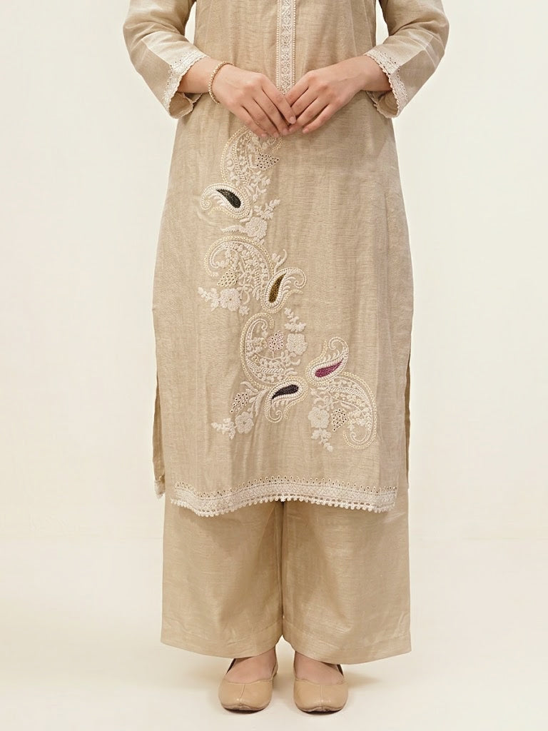 Beige chanderi cotton suit set with paisley embroidery, lace detail, and matching dupatta, featuring intricate thread embroidery on kurta