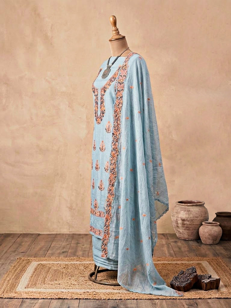 Powder blue Chanderi cotton embroidered suit set with kurta, churidar, and dupatta, featuring intricate thread embroidery.