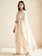 Cream floral cross-stitch cotton linen suit set by KARCHOBI featuring embroidered kurta, pants, and dupatta for women.