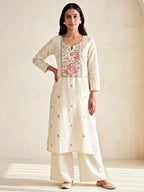 Cream floral cross-stitch cotton linen suit set with embroidered dupatta, featuring kurta and matching pants, by KARCHOBI.