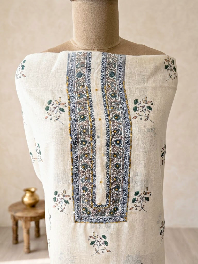 Off-white cotton linen unstitched suit set with floral paisley prints, includes kurta, pants, and dupatta.