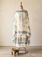 Off-white cotton linen unstitched suit set with floral paisley prints, including kurta, pants, and dupatta from KARCHOBI.