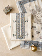 Off-white cotton linen unstitched suit set with floral paisley prints, includes kurta, pants, and dupatta by Karchobi.