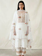White cotton linen cross-stitch embroidery suit set with kurta, pants, and dupatta by Karchobi, featuring intricate embroidery details.