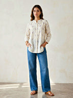 Off-White lilac floral embroidery cotton shirt by Karchobi, shown on a hanger, casual and workwear style with detailed floral patterns.
