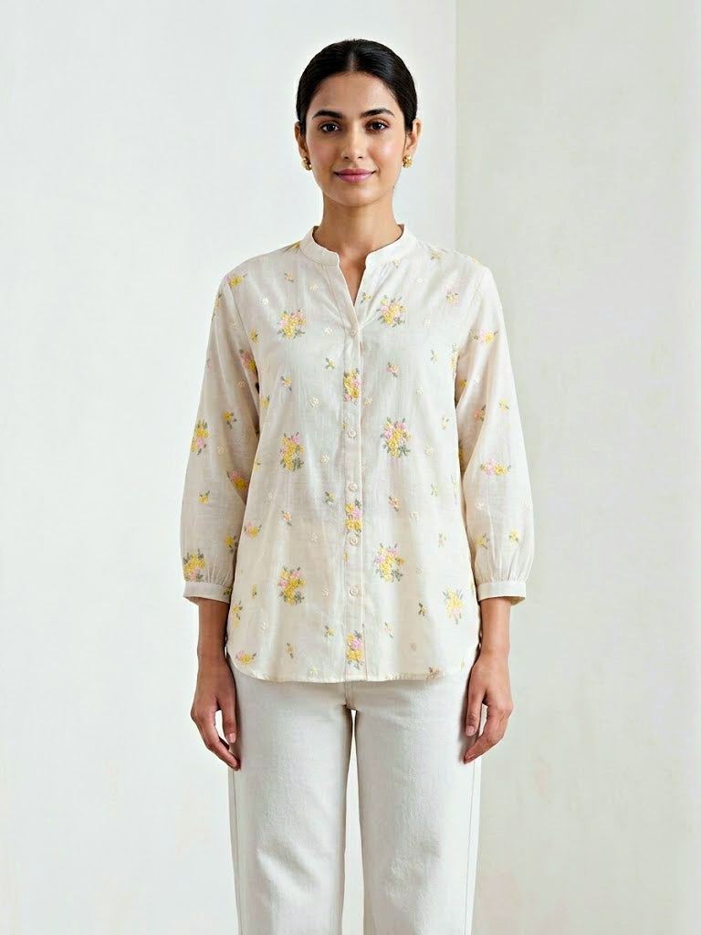 KARCHOBI off-white cotton shirt with yellow floral embroidery, casual workwear style, featuring pastel floral design.