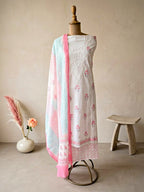 White cotton block print unstitched suit set by Karchobi featuring floral kurta, palazzo pants, and matching dupatta for women.