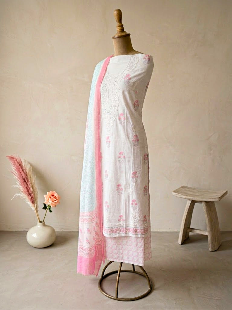 White cotton block print unstitched suit set by Karchobi, includes floral kurta, pants, and dupatta for casual or workwear.