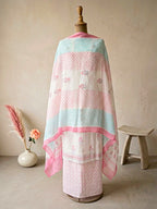 White cotton block print unstitched suit set by Karchobi with floral kurta, matching pants, and dupatta for women.