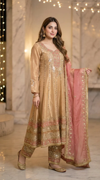 Woman wearing gold beige embroidered Anarkali suit with pink dupatta from Karchobi