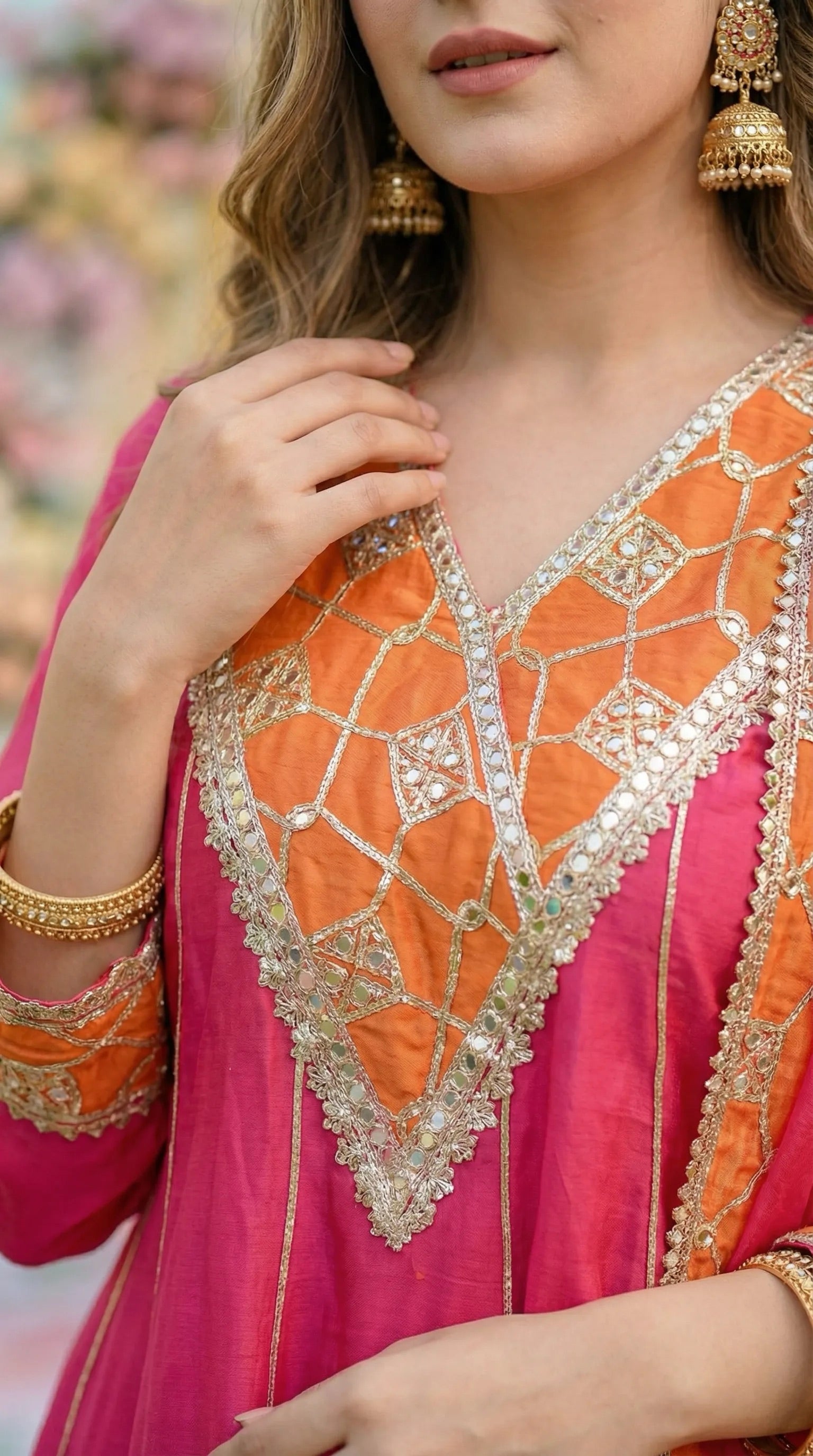 Hot pink and orange Anarkali sharara set with gota, sequin, and mirror work by Karchobi