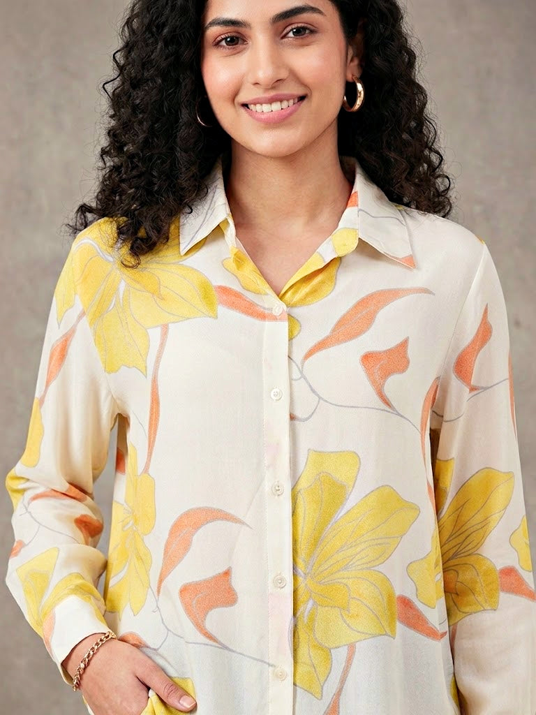 Ivory and yellow floral crepe shirt by KARCHOBI featuring pastel floral print, casual workwear style, long sleeves and button front.