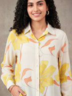 Ivory and yellow floral crepe shirt by KARCHOBI featuring pastel floral print, casual workwear style, long sleeves and button front.