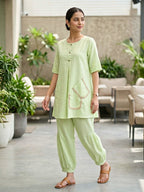 KARCHOBI lemon green linen slub co-ord set with jute lace trims and pleated Afghani salwar for casual wear.