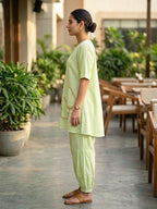 Lemon green linen slub co-ord set with jute lace trim, featuring pleated Afghani salwar, casual stylish wear by KARCHOBI.