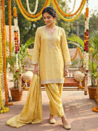 Lemon yellow shimmer tissue Farsi Salwar suit set with sequin lace detailing by KARCHOBI, festive traditional Indian attire.