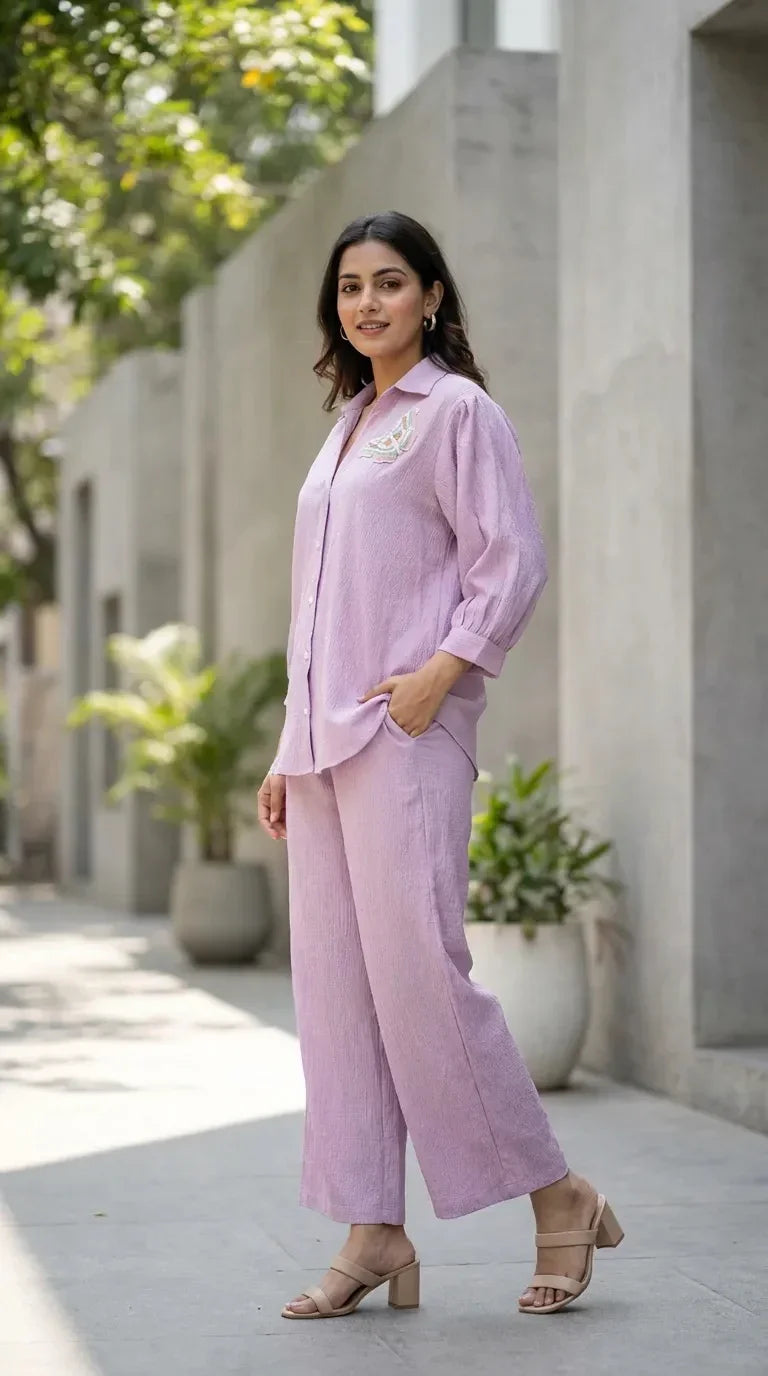 Woman wearing light lilac textured shirt co-ord set with butterfly motif from Karchobi