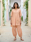 Light peach orange Karchobi Afghani salwar co-ord set featuring a cotton-linen kurta and matching trousers.