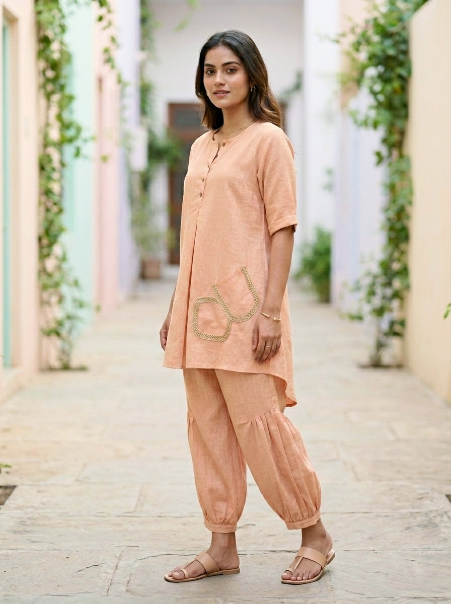 Light peach orange Afghani salwar co-ord set by Karchobi, featuring a kurta and salwar in cotton-linen fabric.