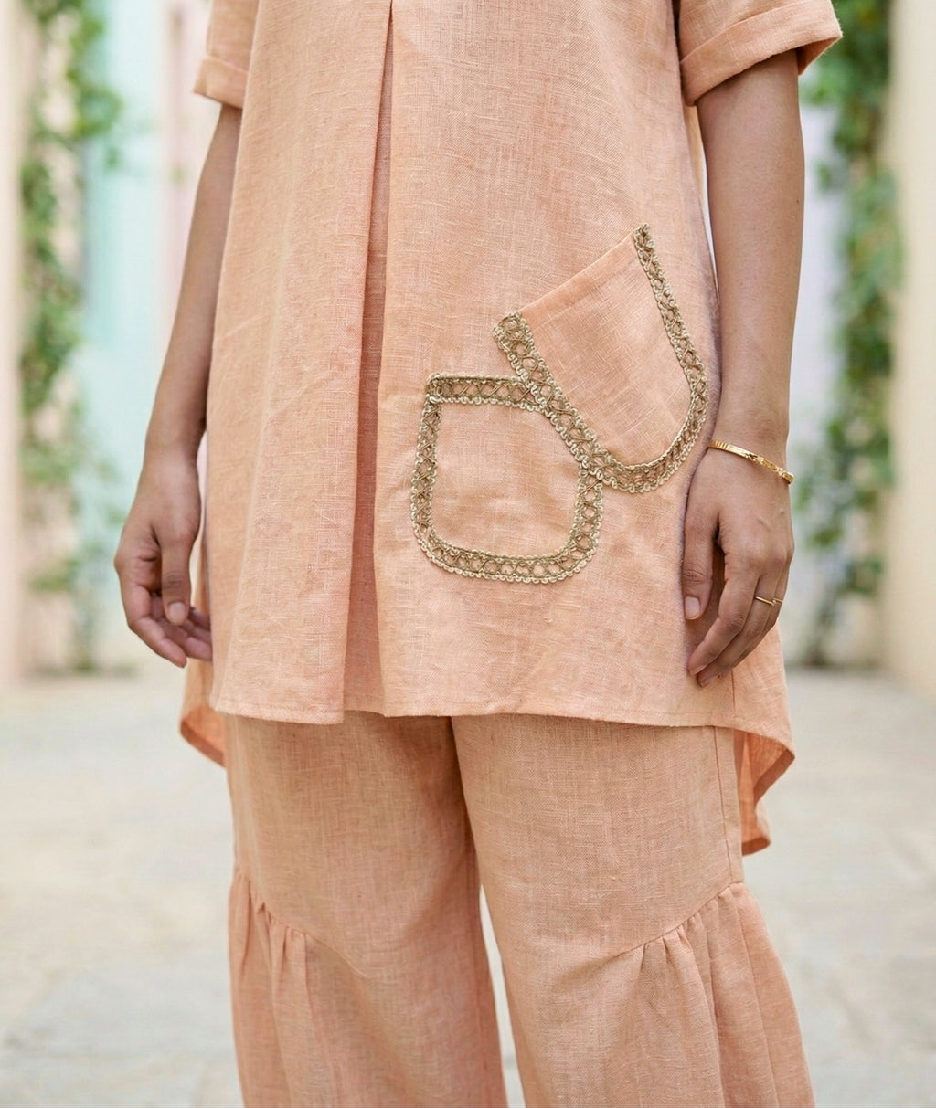 Light peach orange Karchobi Afghani salwar co-ord set featuring a stylish kurta and comfortable salwar pants.