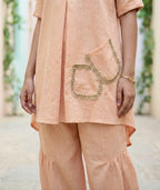 Light peach orange Karchobi Afghani salwar co-ord set featuring a stylish kurta and comfortable salwar pants.