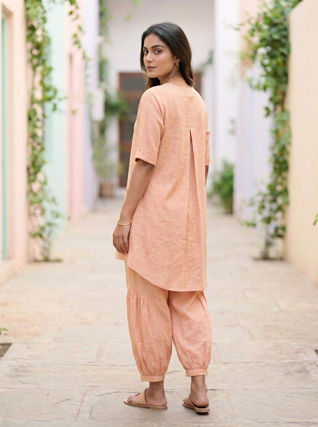 Light peach orange Afghani salwar co-ord set by Karchobi featuring a kurta and matching salwar in cotton linen.