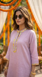 Woman wearing lilac textured kaftan shirt with pastel scalloped lace, outdoor setting, Karchobi fashion