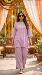 Woman wearing lilac textured kaftan shirt and pant set with scalloped lace from Karchobi