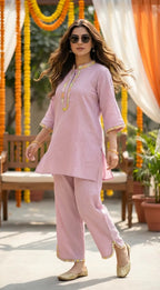 Woman wearing lilac textured kaftan shirt and pants set with scalloped lace, outdoor setting, Karchobi