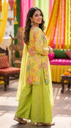 Woman in Karchobi lime green and yellow floral sequin embroidered kurta sharara set