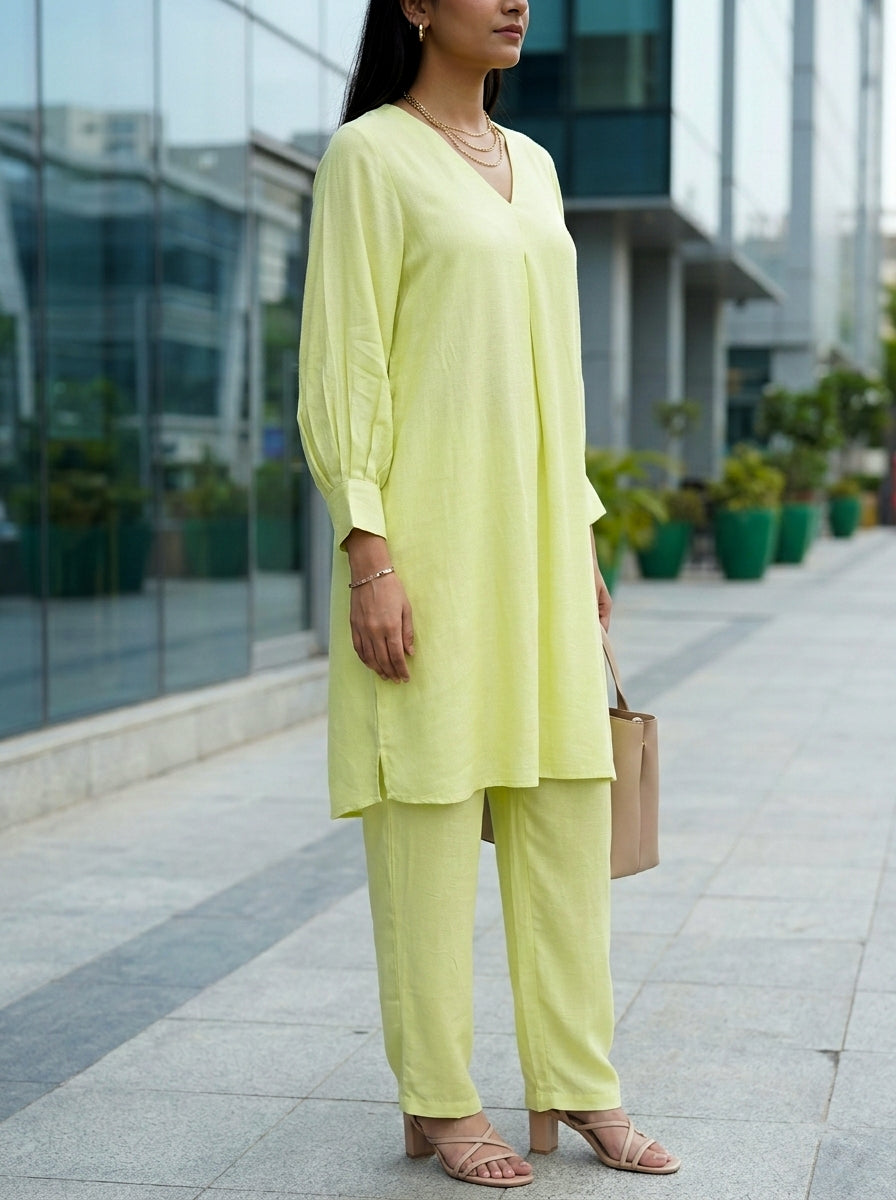 Lime green box pleat kurta and pant co-ord set by Karchobi, showcasing a stylish women's outfit in rayon slub fabric.