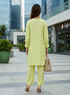 Lime green box pleat kurta and pant co-ord set by Karchobi, featuring a stylish design in soft rayon slub fabric.