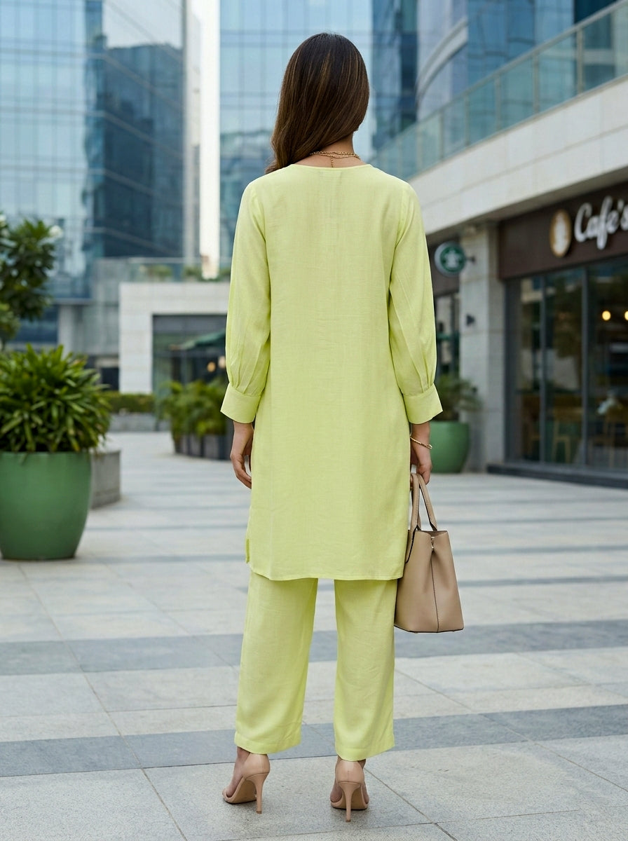 Lime green box pleat kurta and pant co-ord set by Karchobi, featuring a stylish design in soft rayon slub fabric.