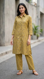 Woman wearing Mehndi green tropical print kurta pant co-ord set by Karchobi outdoors