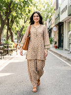 Ivory beige cotton mul paisley co-ord set with Croatia lace trims, casual wear by KARCHOBI featuring colorful paisley print and Afghani salwar style