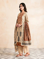 Beige rust muslin cotton Ajrak suit set with intricate print, Gota work, kurta, pants, and dupatta for women by Karchobi.