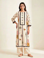 Cream muslin cotton suit set with floral and tree print kurta, pant, and dupatta from Karchobi for women.