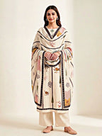Ivory cream muslin cotton suit set with floral and tree prints, includes kurta, pants, and dupatta, by Karchobi.