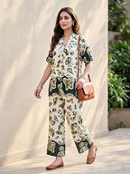 Off-white and green rayon slub kurta and pant co-ord set with floral design, featuring box pleat details, by Karchobi.