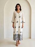 Off-white and black floral applique embroidered kurta dress by Karchobi, featuring intricate embroidery and a long, elegant design.