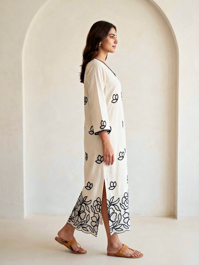 Off-White Karchobi embroidered kurta dress with floral applique, long black and white design, featuring intricate embroidery details.