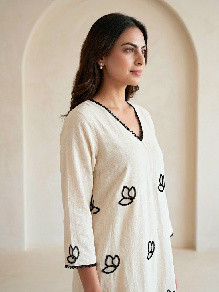 Off-White KARCHOBI embroidered kurta dress with floral appliqué and embroidery, long black and off-white traditional Indian attire