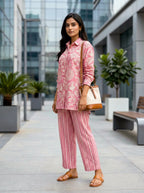 Onion pink cotton linen co-ord set featuring abstract print shirt and striped pants by Karchobi.