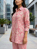 Women's Karchobi onion pink cotton linen co-ord set featuring an abstract print shirt and striped pants.